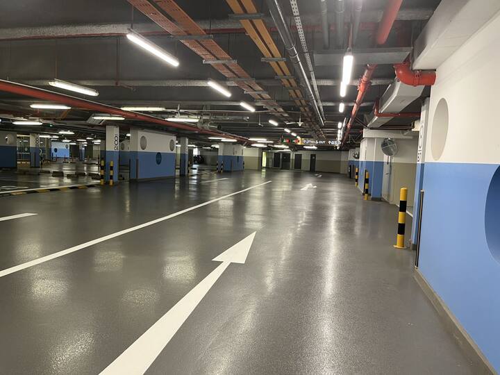 Linear LED luminaires running the length of a basement carpark deck at SZ Carpark